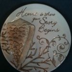 decorative plate that says "Home is where your story begins"