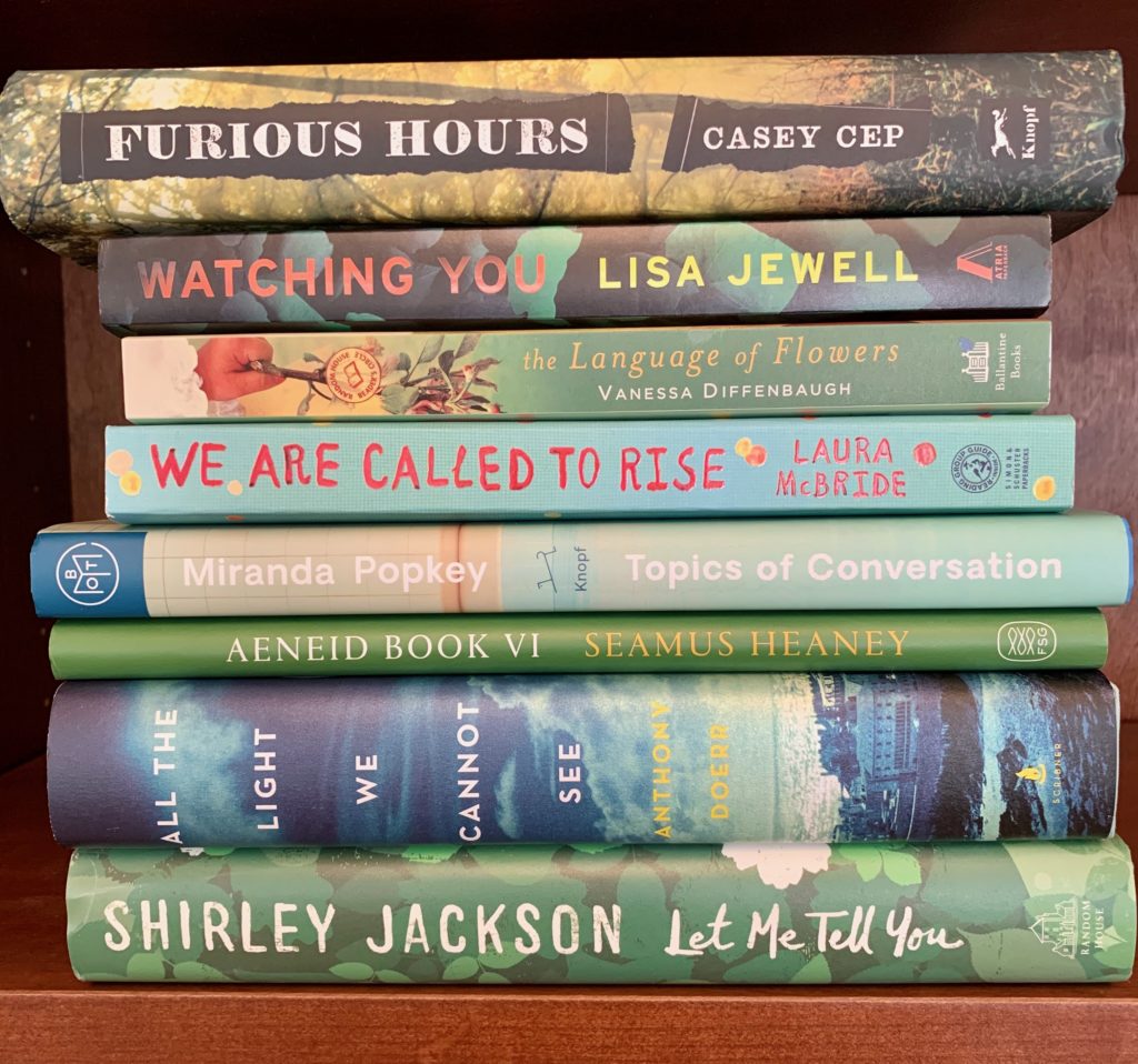 stack of books with green covers