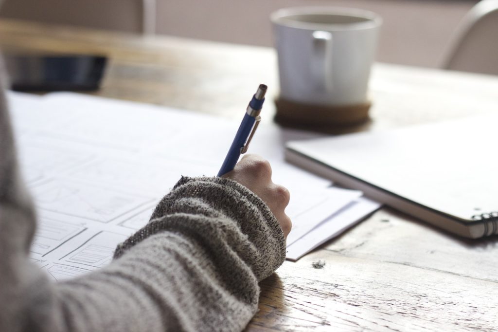 woman writing in notebook