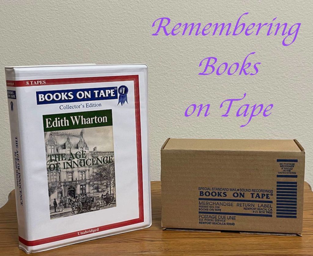 2 containers of Books on Tape: (left), an upright container of tapes of The Age of Innocence by Edith Wharton, and (right) a cardboard box addressed for return to Books on Tape in California.