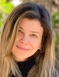 Head shot: a white woman with long, light brown hair.